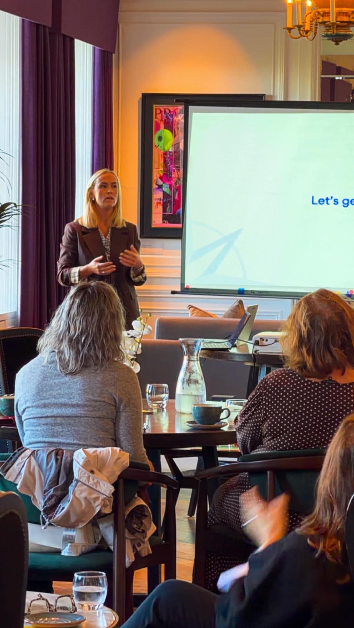 A speaker sharing her presentation at the Wealth and Wellbeing gathering