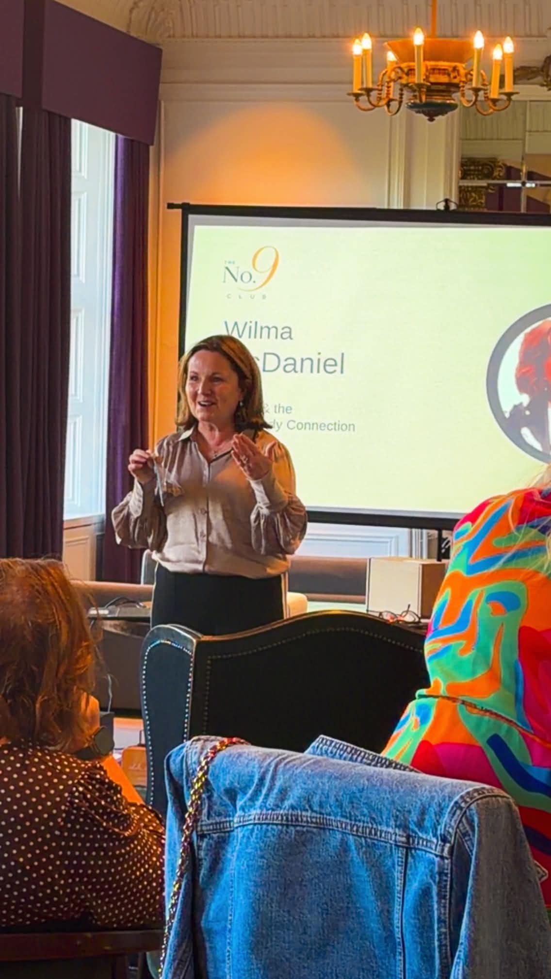 Wilma McDaniel speaking at the Wealth and Wellbeing gathering